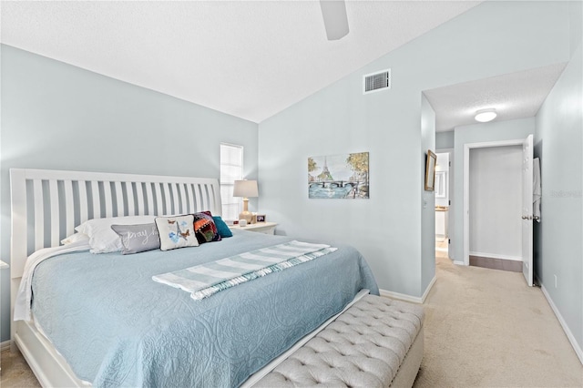 carpeted bedroom with ceiling fan and lofted ceiling