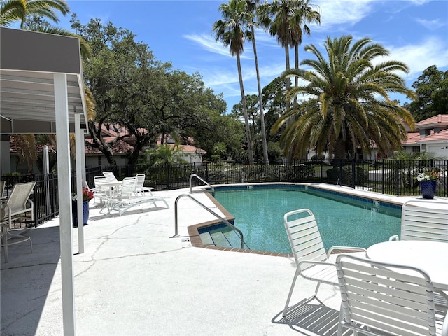 view of swimming pool featuring a patio