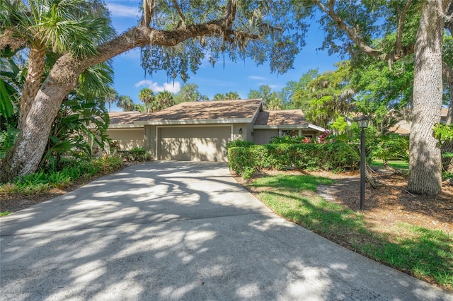 single story home featuring a garage