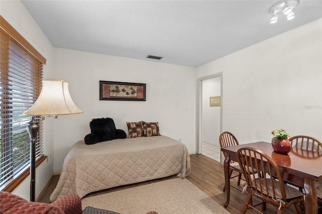 bedroom with wood-type flooring