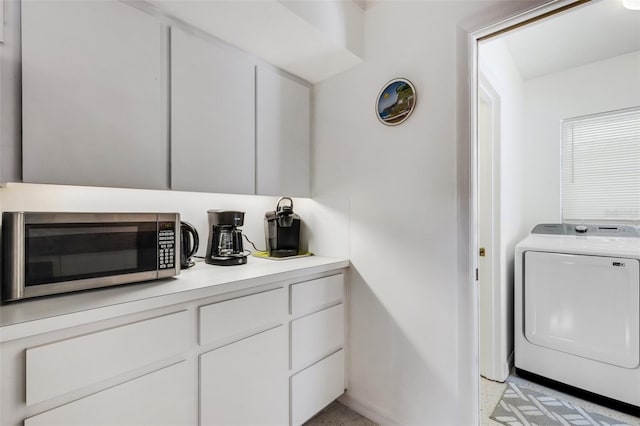 laundry room featuring washer / dryer