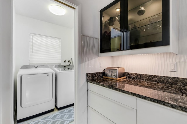 clothes washing area featuring washer and dryer