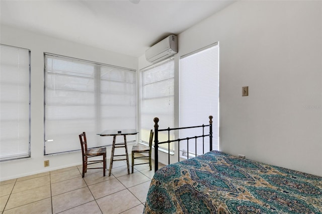 tiled bedroom featuring a wall mounted AC