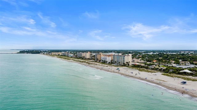 aerial view featuring a water view and a beach view