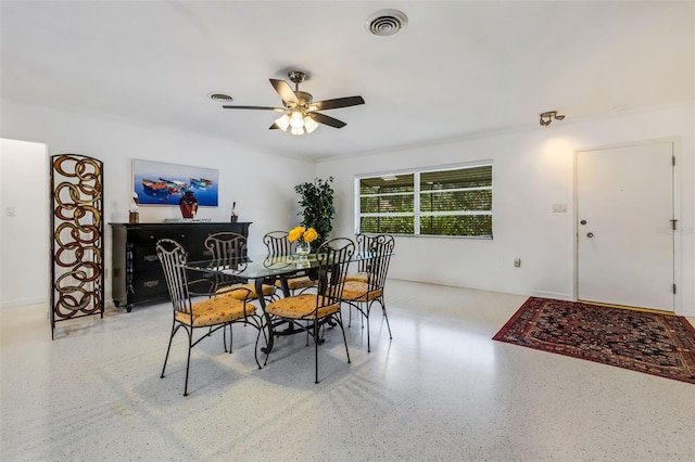 dining space with ceiling fan