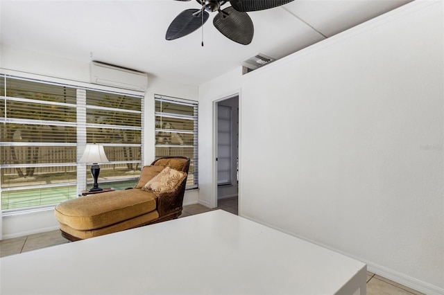 bedroom featuring an AC wall unit, ceiling fan, and light tile patterned flooring