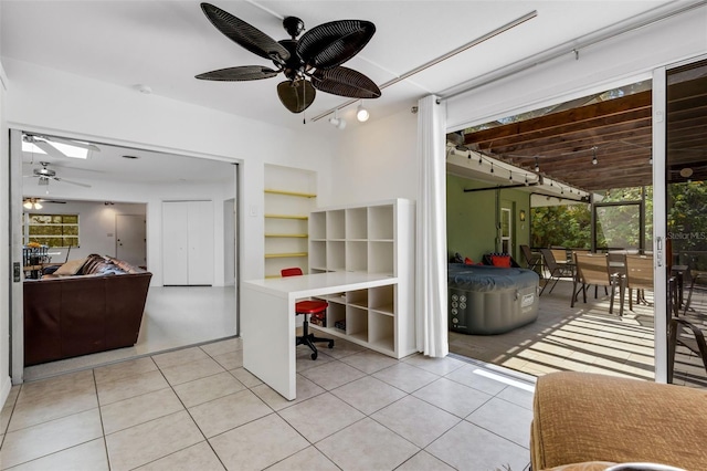 tiled home office with ceiling fan