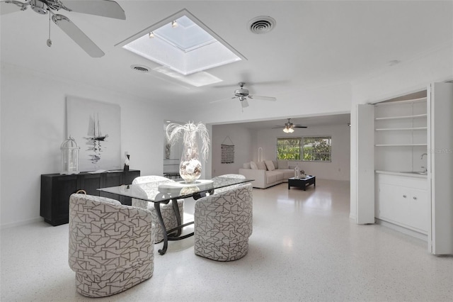 701 Armada Rd S, Venice, FL 34285 - interior space featuring speckled floor, ceiling fan, visible vents, and a skylight