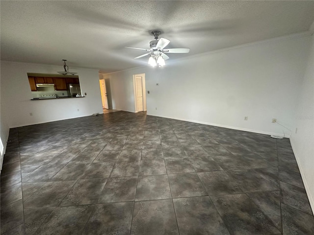 unfurnished living room with dark tile flooring, ceiling fan, a textured ceiling, and ornamental molding