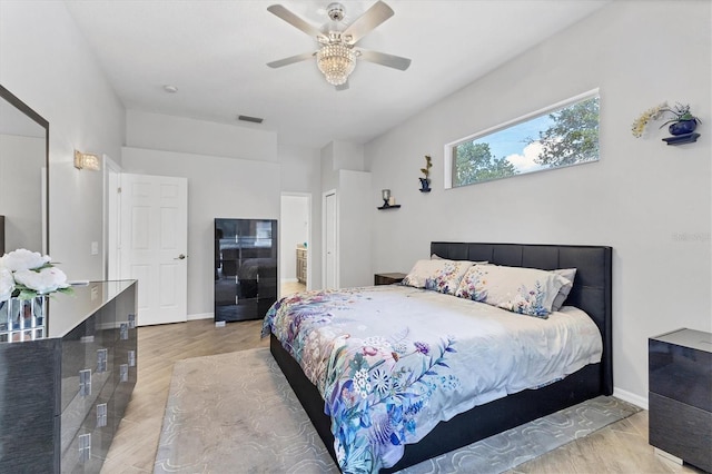 bedroom with ceiling fan and light hardwood / wood-style flooring