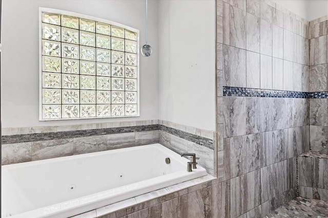 bathroom with tiled tub