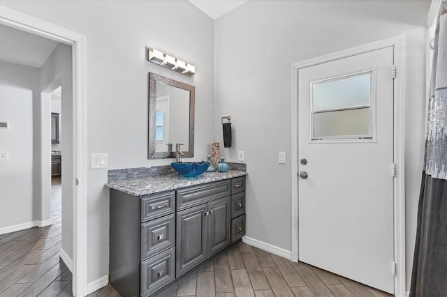 bathroom featuring vanity and hardwood / wood-style flooring