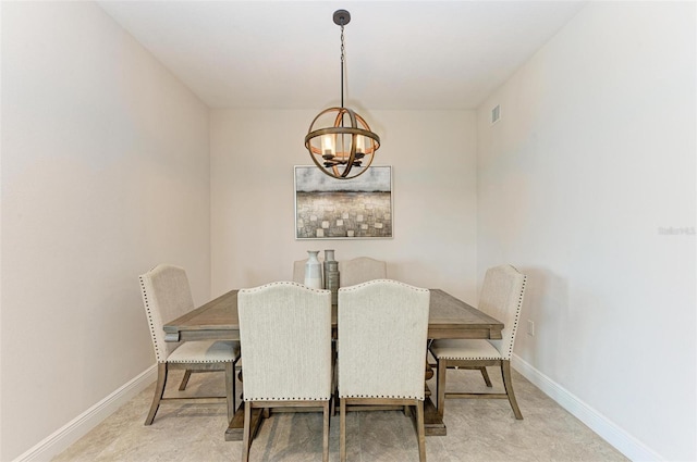 carpeted dining space with an inviting chandelier