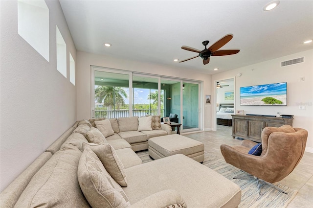 living room with ceiling fan and light tile floors