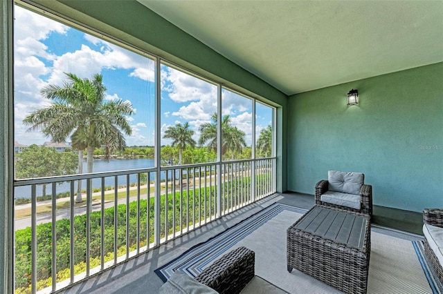 sunroom / solarium with a water view