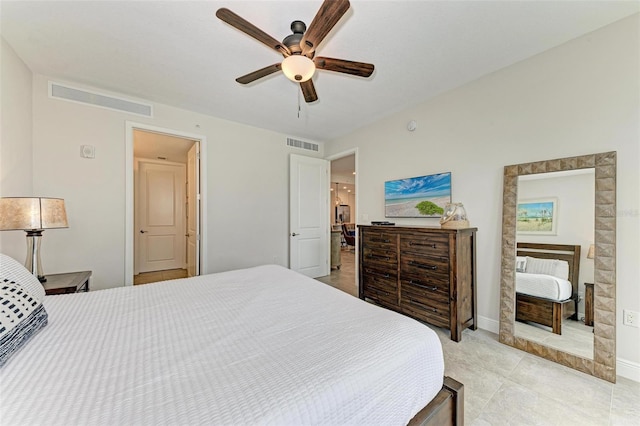 bedroom with ceiling fan and light tile floors