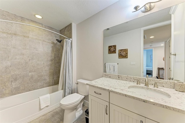 full bathroom featuring tile flooring, vanity with extensive cabinet space, shower / tub combo, a textured ceiling, and toilet