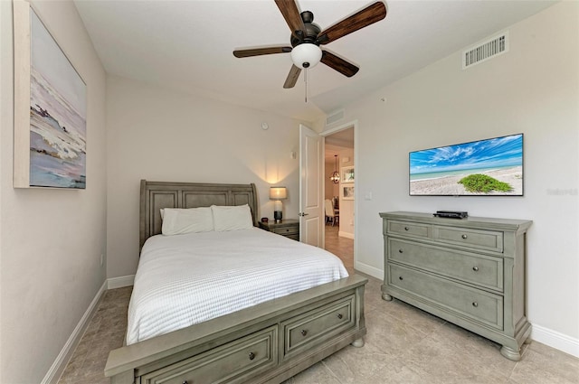 bedroom with ceiling fan and light tile flooring