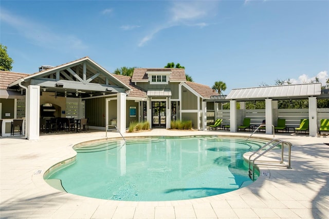 view of swimming pool with a patio area