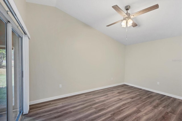 empty room featuring ceiling fan, dark hardwood / wood-style flooring, and vaulted ceiling