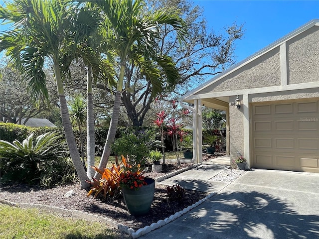 exterior space featuring a garage and concrete driveway