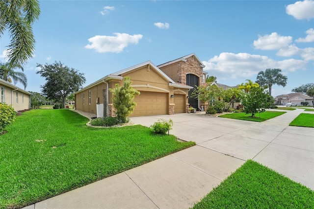 view of front of property featuring a garage and a front yard