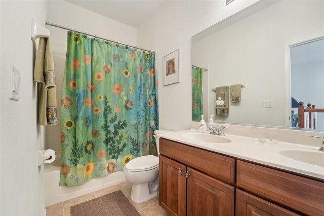 full bathroom with oversized vanity, dual sinks, toilet, tile flooring, and shower / tub combo with curtain