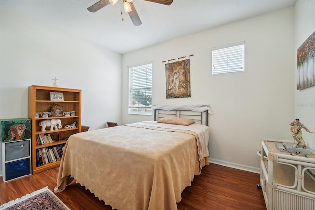 bedroom featuring dark wood-type flooring and ceiling fan