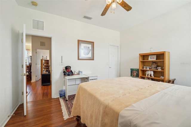 bedroom featuring ceiling fan and dark hardwood / wood-style floors