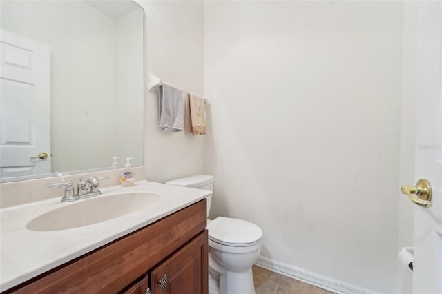 bathroom featuring vanity, toilet, and tile floors