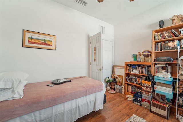 bedroom with hardwood / wood-style floors