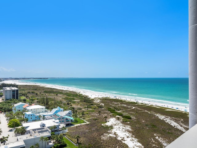 birds eye view of property featuring a water view and a view of the beach