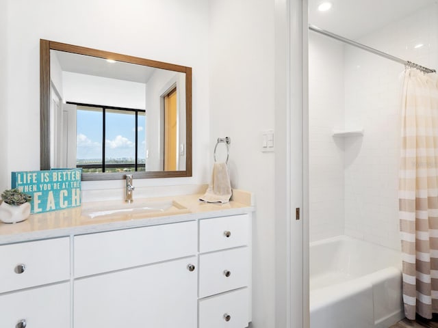 bathroom featuring vanity and shower / tub combo with curtain