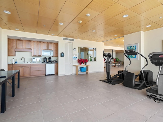 interior space featuring light tile patterned floors and sink