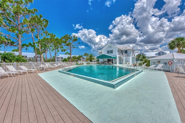 view of pool with a wooden deck