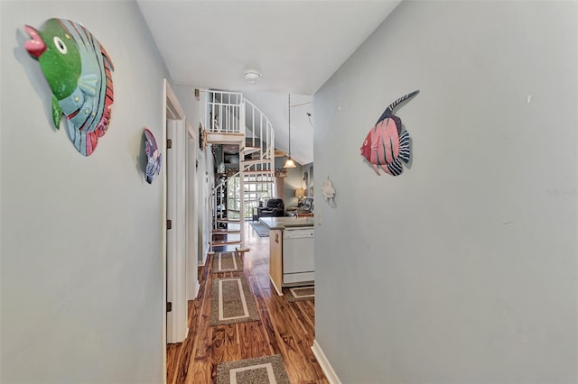 hall with hardwood / wood-style flooring