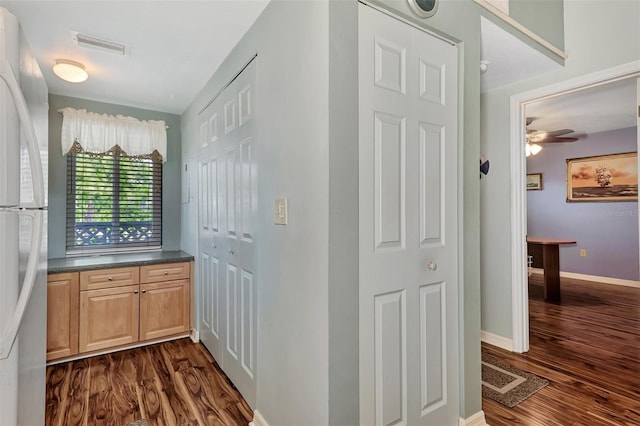 interior space with dark hardwood / wood-style flooring