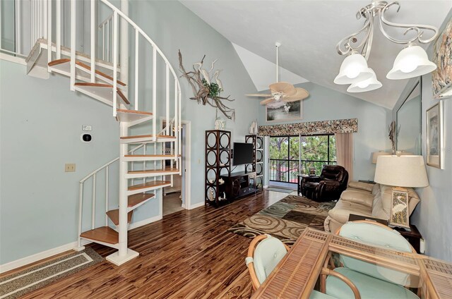 living room featuring high vaulted ceiling, wood-type flooring, and ceiling fan with notable chandelier