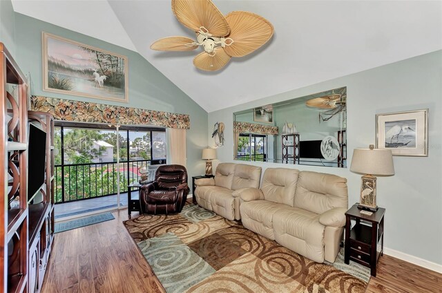 living room featuring high vaulted ceiling, ceiling fan, and hardwood / wood-style floors