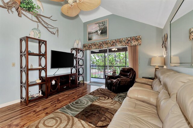 living room with high vaulted ceiling, ceiling fan, and hardwood / wood-style floors