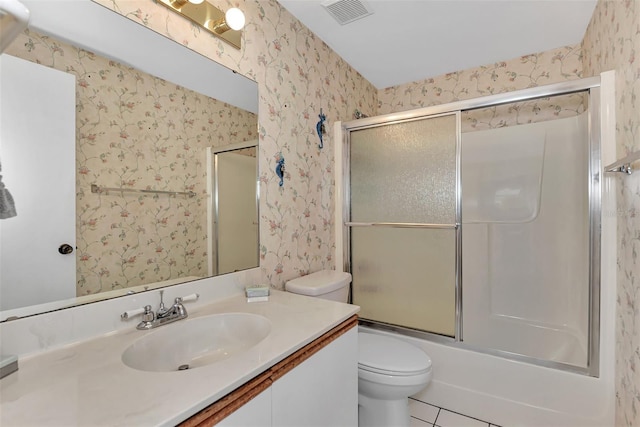 full bathroom featuring tile flooring, vanity, toilet, and enclosed tub / shower combo