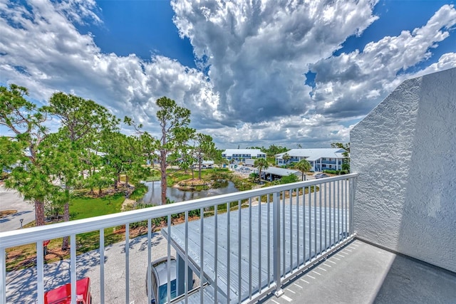 balcony featuring a water view