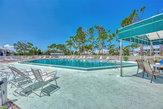 view of swimming pool featuring a patio