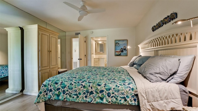 bedroom with connected bathroom, ceiling fan, and light wood-type flooring