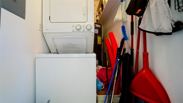 laundry area with stacked washer and clothes dryer