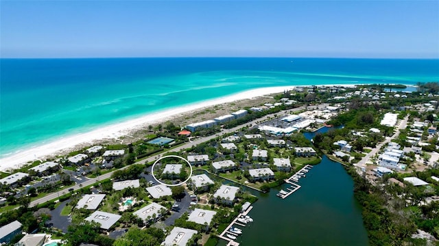 aerial view featuring a water view and a view of the beach