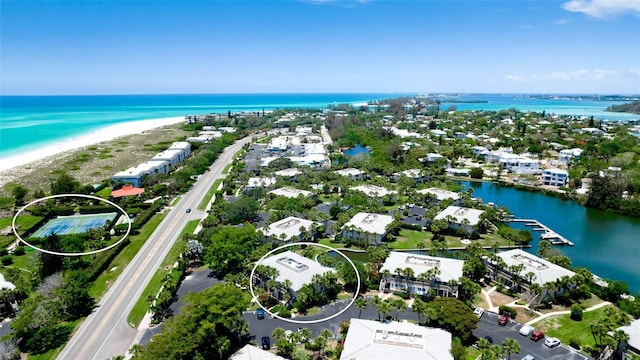 bird's eye view featuring a view of the beach and a water view