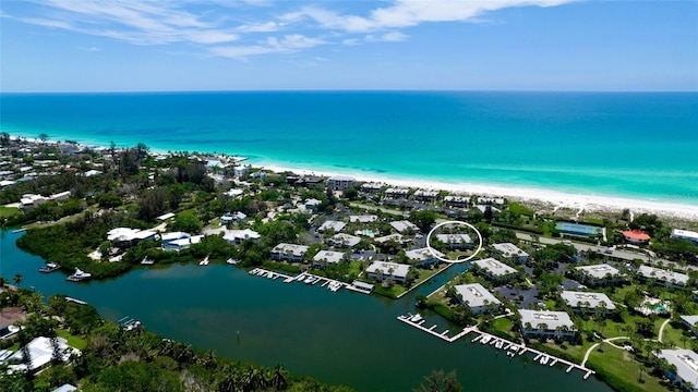 bird's eye view featuring a beach view and a water view