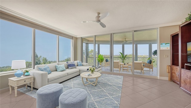 sunroom / solarium featuring ceiling fan