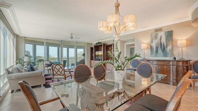 tiled dining room with ornamental molding, expansive windows, and ceiling fan with notable chandelier